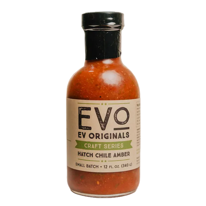 Bottle of Evo Originals Hatch Chile Amber sauce on a white background